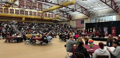 A large crowd gathers on the basketball court at the Murray Center for Accepted Students Day 2024